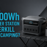 Camper using a 1000Wh portable power station at a remote campsite